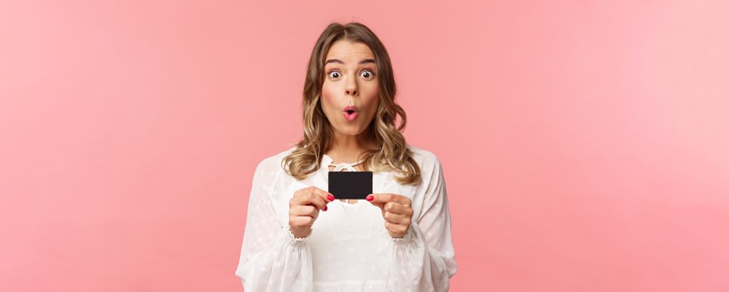 closeup portrait excited amused young girl describe new features her bank received new credit card say wow folding lips thrilled amazed standing pink background - BdThemes