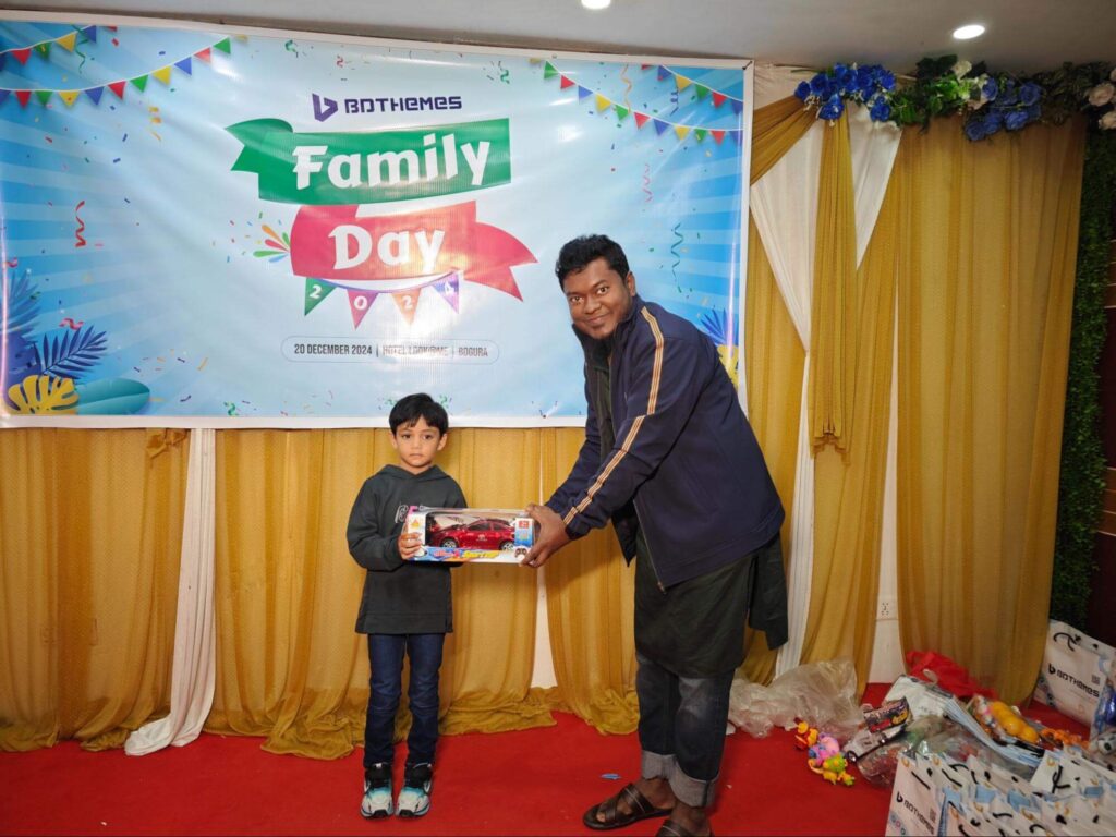 a kid receiving gift from bdthemes ceo 1 - BdThemes